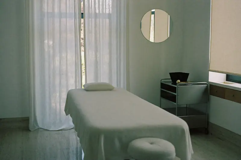 A treatment room with sheer curtains